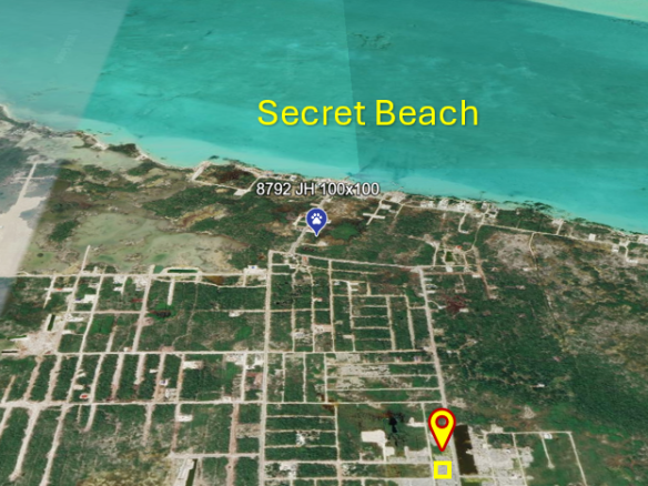 Aerial view of an individual lot near Secret Beach surrounded by developing off-grid vacation rentals.