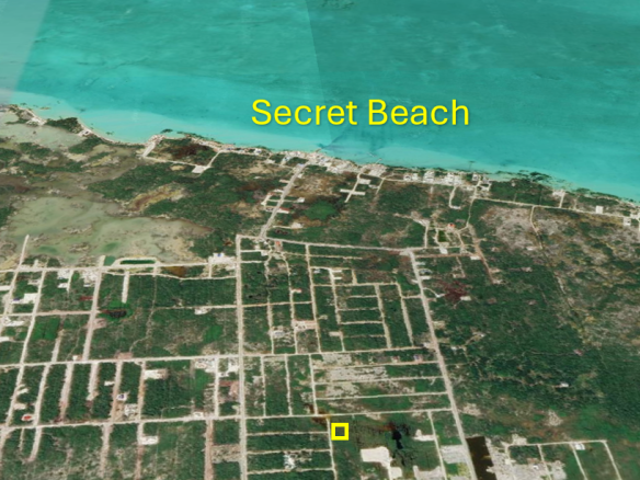 Aerial view of Grand Belizean Estates land lot highlighting short distance to Secret Beach on Ambergris Caye.