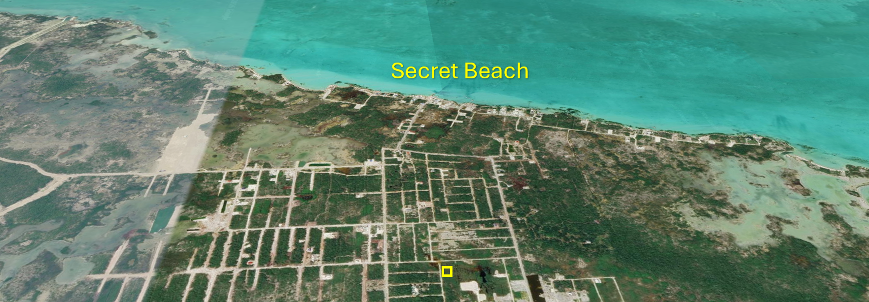 Aerial view of Grand Belizean Estates land lot highlighting short distance to Secret Beach on Ambergris Caye.